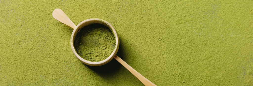 Matcha tea backgrounds: matcha tea bamboo strainer . top View Copy Space